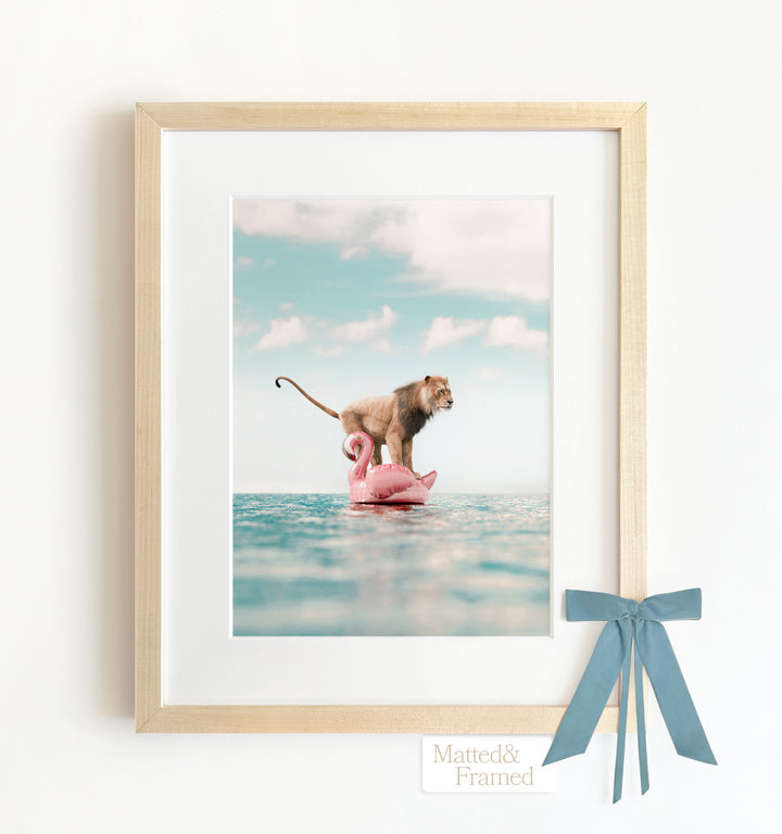 Lion Afloat a Flamingo Framed Art